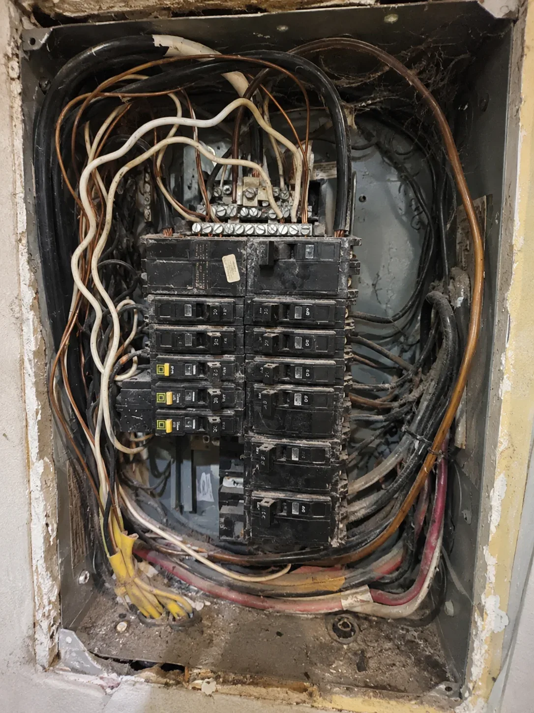 Old residential electrical panel before replacement