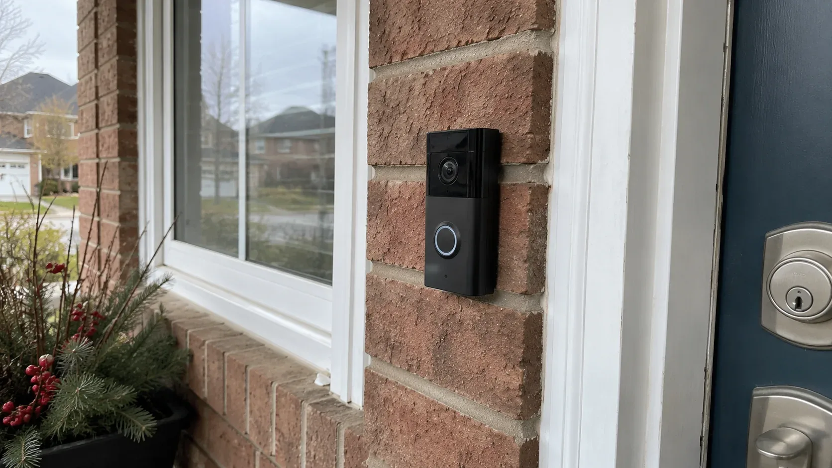 Ring video doorbell mounted on an exterior brick wall